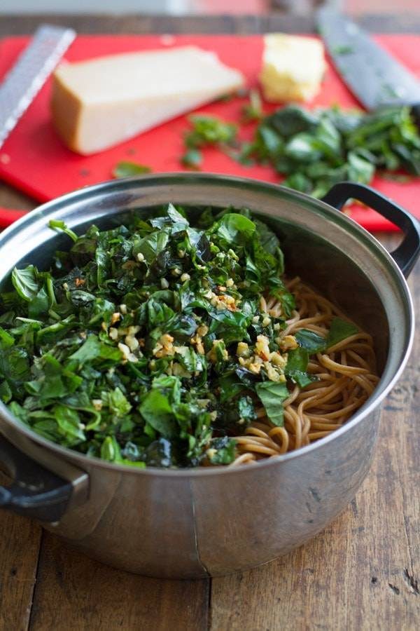 Garlic butter spaghetti with herbs in a pot.