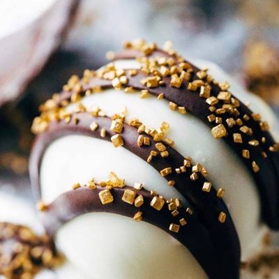 Minty Chocolate Cake Bites on pan with chocolate drizzle.