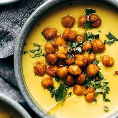 Golden Soup in bowls with chickpea topping.