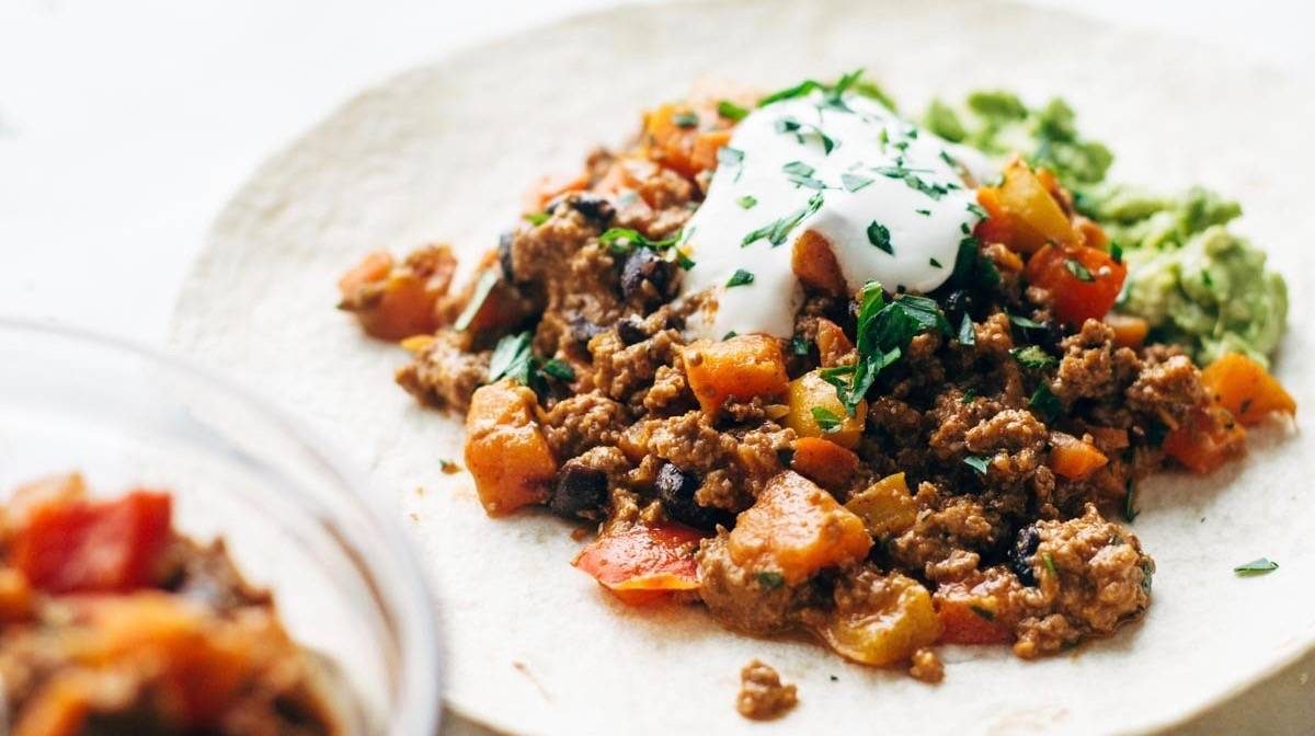 Chipotle Turkey Burrito held by hands.